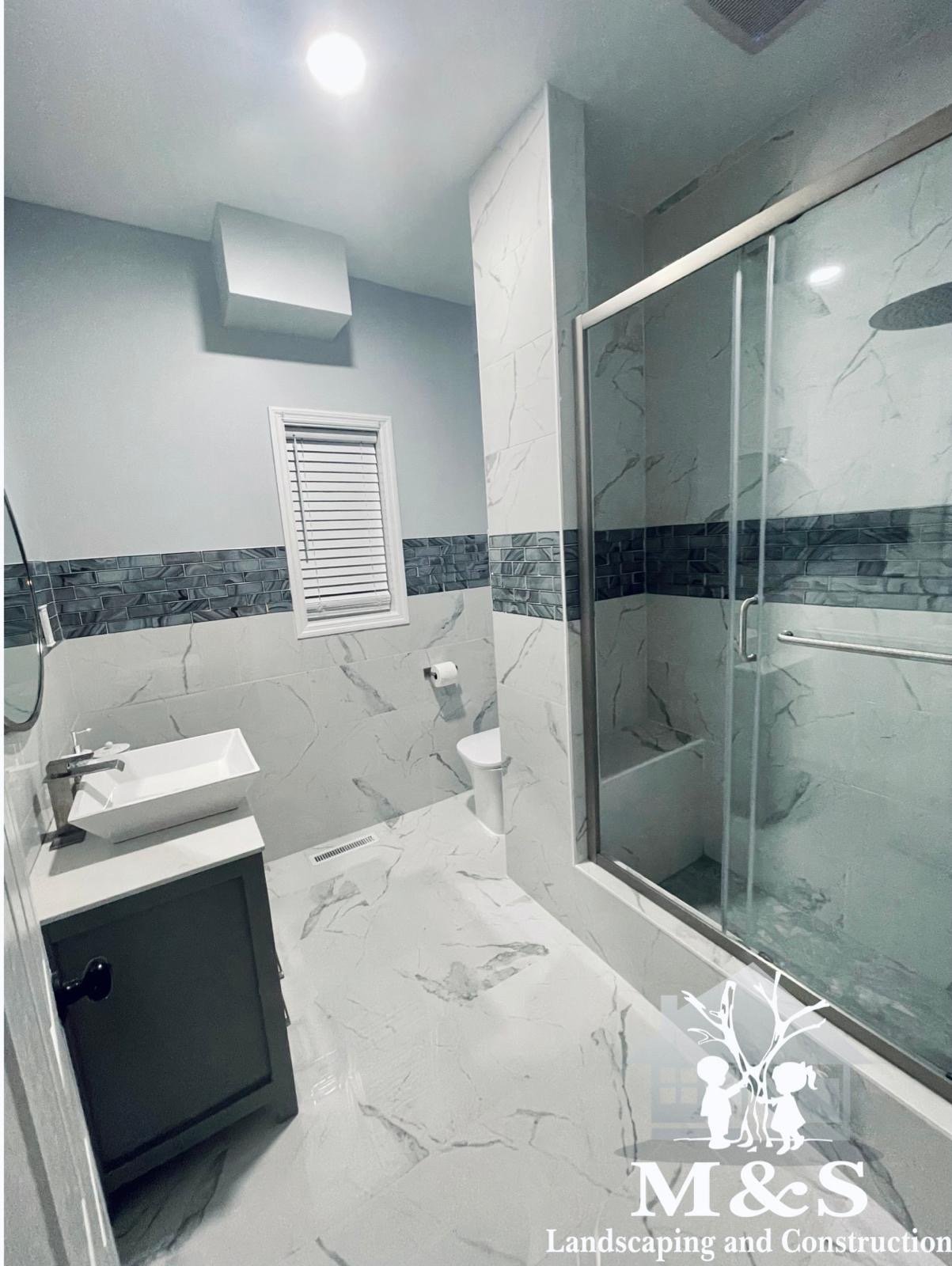 Finished bathroom remodeling with custom shower and tile work